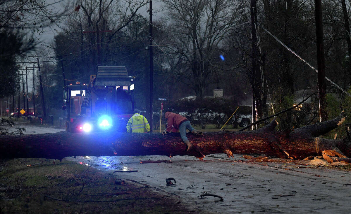 Crews are working to remove a large tree blocking Allie Payne Road in Little Cypress after it was toppled by a powerful tornado that passed through the area on Tuesday.  Picture taken Tuesday January 24, 2023 Kim Brent/Beaumont Enterprise
