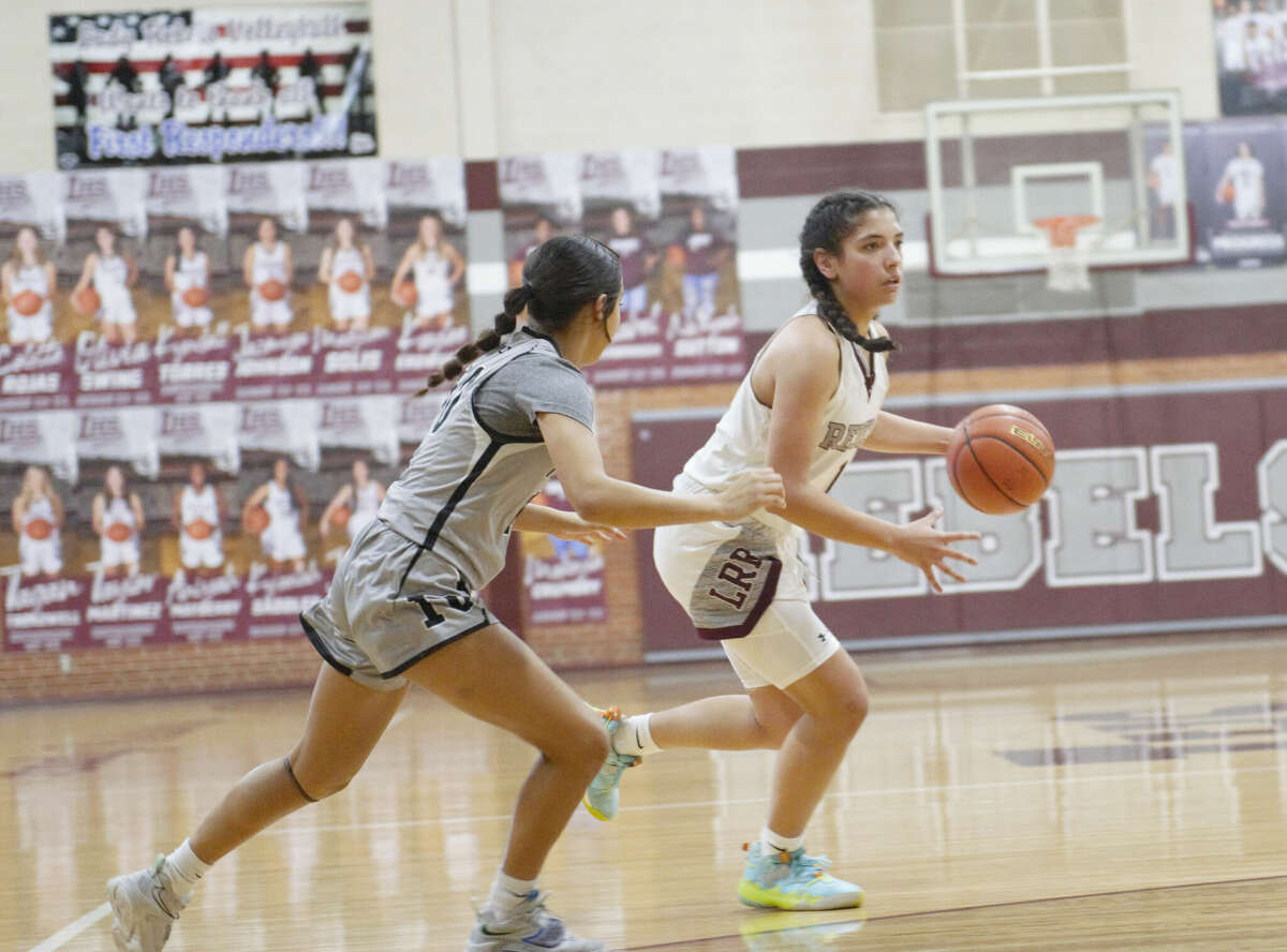 Legacy's Natalie Magallanes dribbles against Odessa Permian's Briseyda Sanchez during a District 2-6A girls basketball game, Jan. 24 at Rebel Gymnasium. 