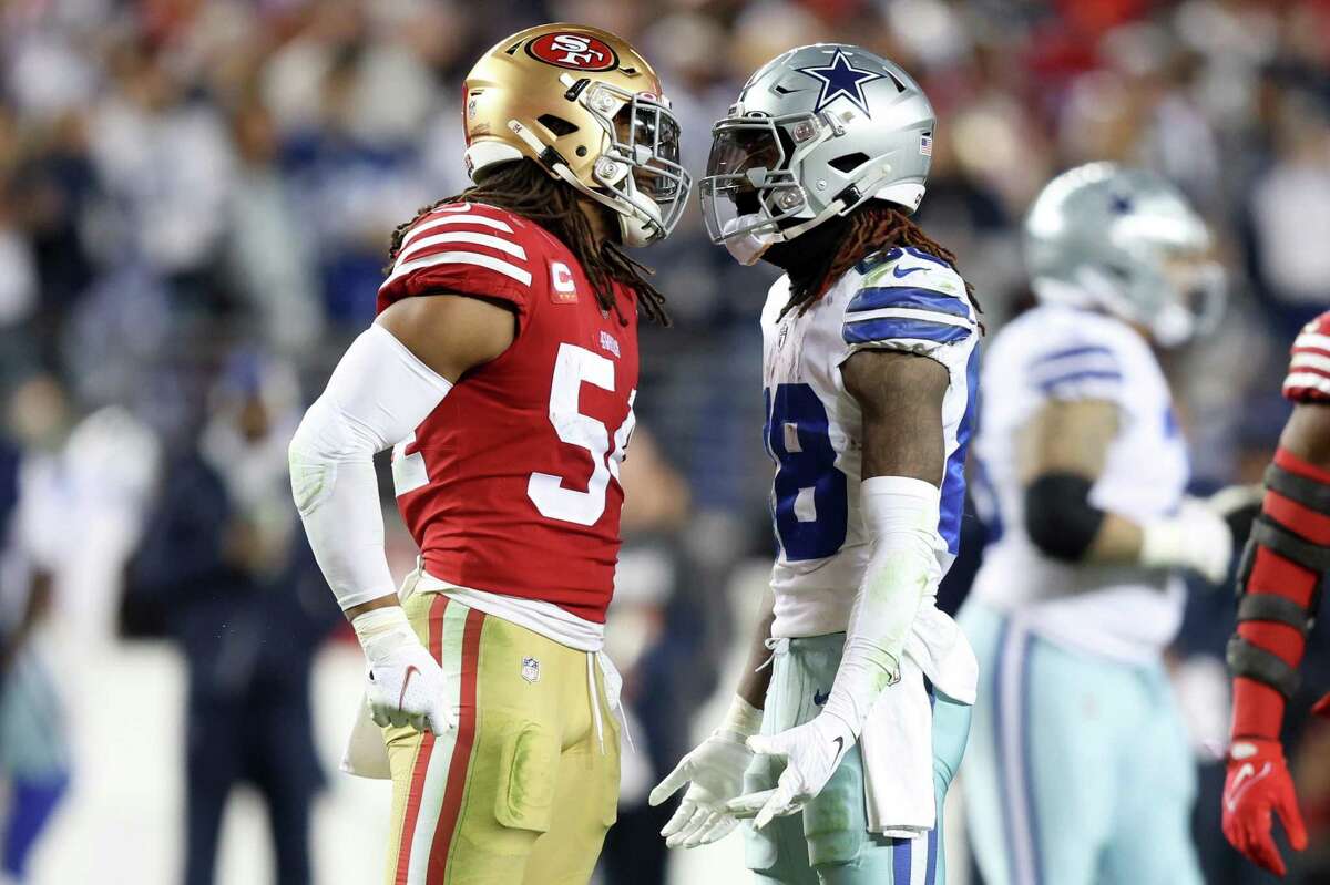 San Francisco 49ers linebacker Fred Warner (54) and Dallas Cowboys wide  receiver CeeDee Lamb (88) after a stop during an NFL divisional round  playoff football game, Sunday, Jan. 22, 2023, in Santa