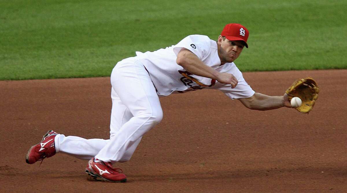 St. Louis Cardinals third baseman Scott Rolen reaches to his left to secure a ground ball hit by San Francisco Giants' Rich Aurilia in the fifth inning at Busch Stadium in St. Louis, July 7, 2007. (Chris Lee/St. Louis Post-Dispatch/TNS)