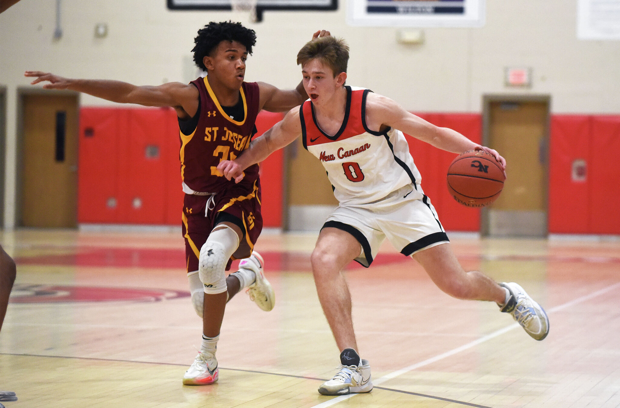 New Canaan ice hockey, basketball, track and field compete in FCIAC