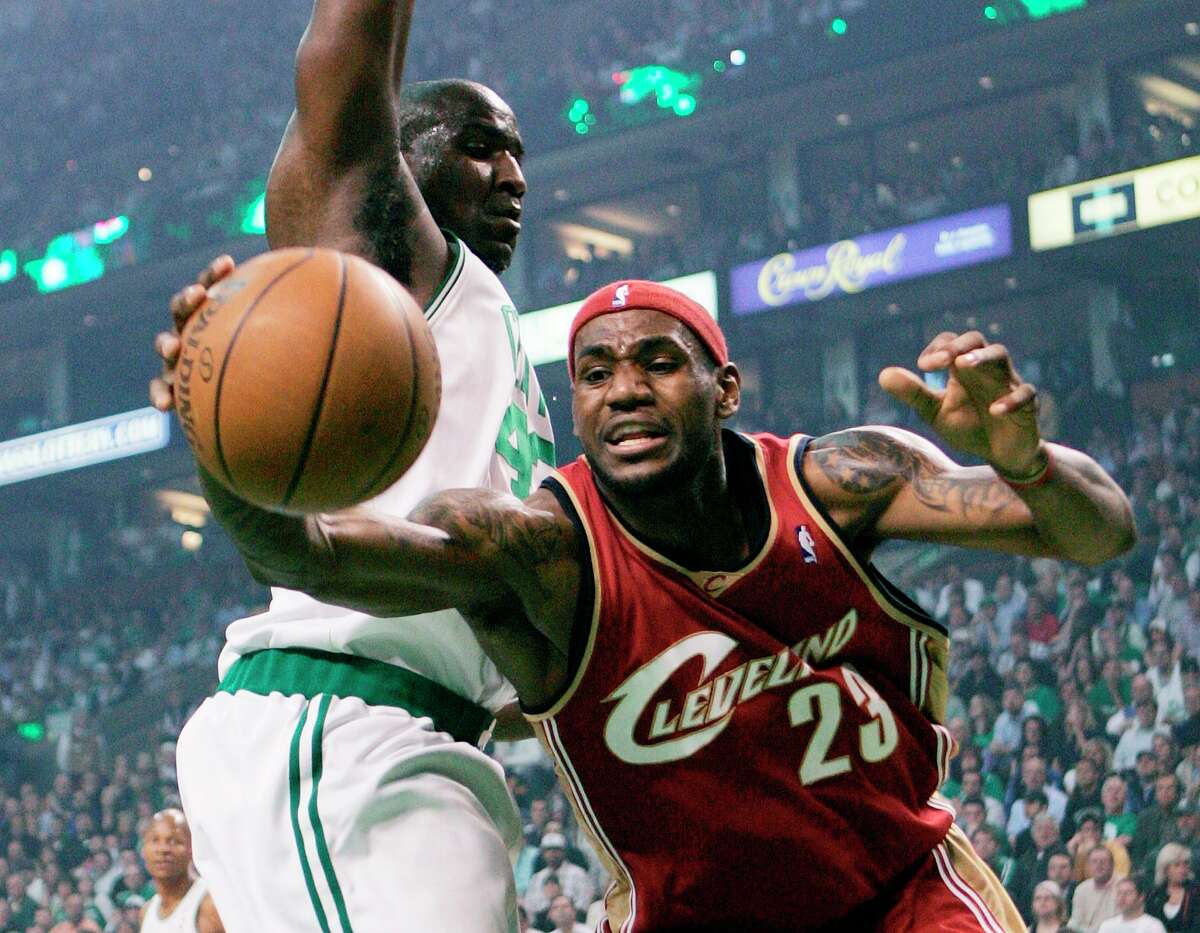Cleveland Cavaliers' LeBron James (23) reaches for the ball after losing control on a drive for the basket past Boston Celtics' Kendrick Perkins, left, during the first quarter of Game 1 of an NBA Eastern Conference semifinal basketball series in Boston, Tuesday, May 6, 2008. (AP Photo/Michael Dwyer)