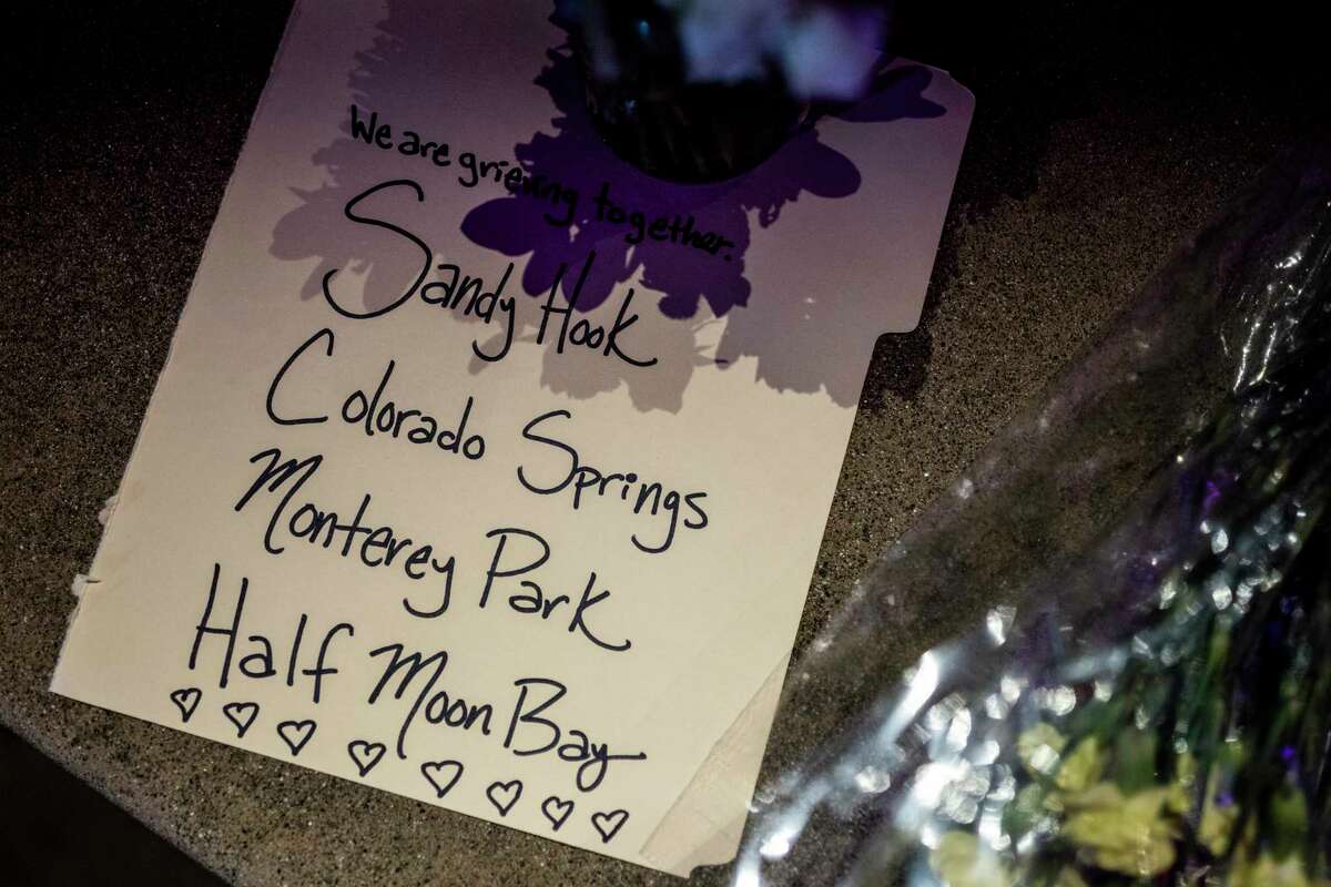 A note is seen at a makeshift memorial at Mac Dutra Park in response to a mass shooting in Half Moon Bay, Calif. Tuesday, Jan. 24, 2023. 