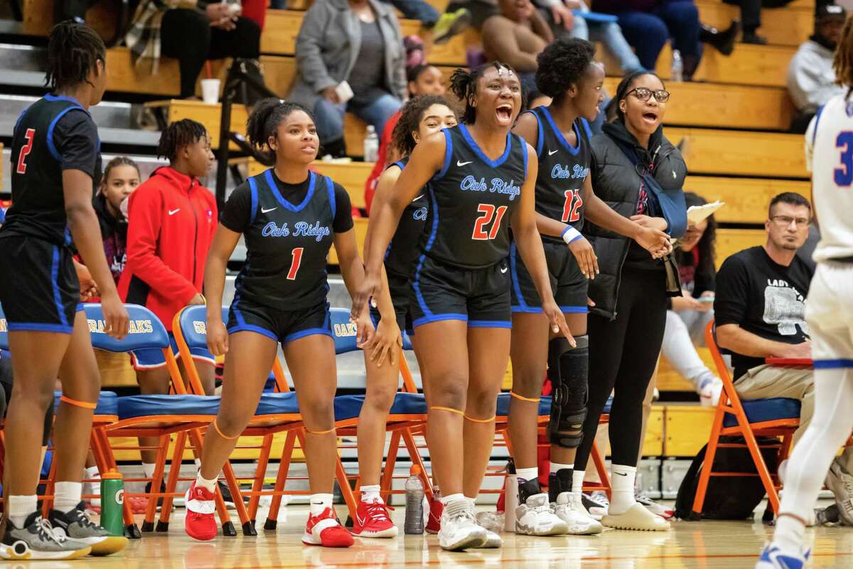 Oak Ridge forward Camile Ito (21) is pictured celebrating on the bench after a foul was called on Grand Oaks in a district high school girlÕs basketball game Tuesday, Jan 24, 2023, in Spring.