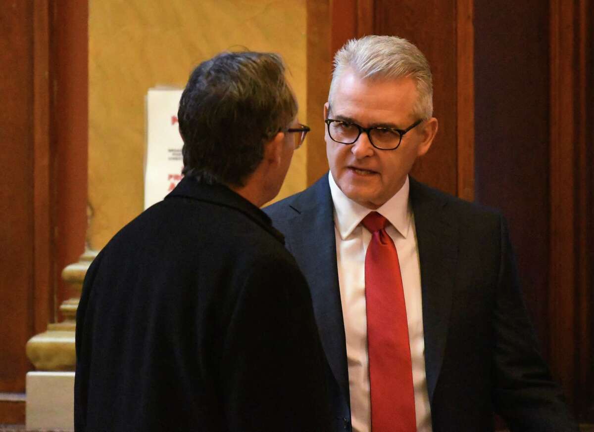 Rensselaer County Executive Steve McLaughlin, right, chats outside the courtroom before beginning day two of his criminal trial on Wednesday Jan. 25, 2023, at Rensselaer County Courthouse in Troy, N.Y. McLaughlin is accused of stealing from his campaign and filing false documents to cover it up.