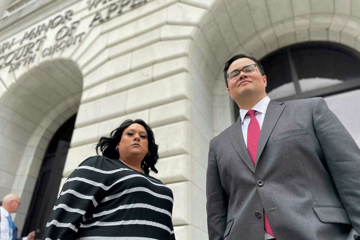 Priscilla Villarreal, an online journalist from Laredo, Texas, stands outside the 5th U.S. Circuit Court of Appeals building in New Orleans on Wednesday, Jan. 25, 2023, with her attorney, J.T. Morris, after the court heard arguments in Villarreal's lawsuit against Laredo and Webb County, Texas, authorities. Her suit says she was wrongfully arrested by Laredo and Webb County authorities in 2017 for seeking information from police. The criminal charge against her was dismissed by a Texas judge in 2018.