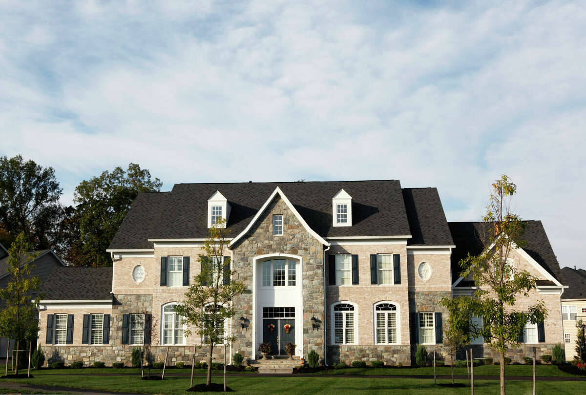 Stock image of a suburban mansion.