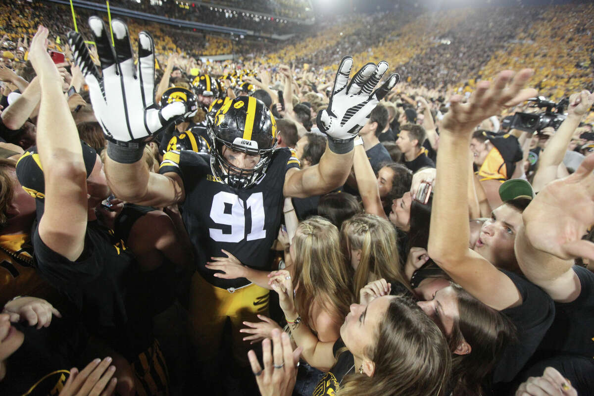 Defensive lineman Lukas Van Ness #91 of the Iowa Hawkeyes celebrates with fans after the match-up against the Penn State Nittany Lions at Kinnick Stadium on October 9, 2021 in Iowa City, Iowa.