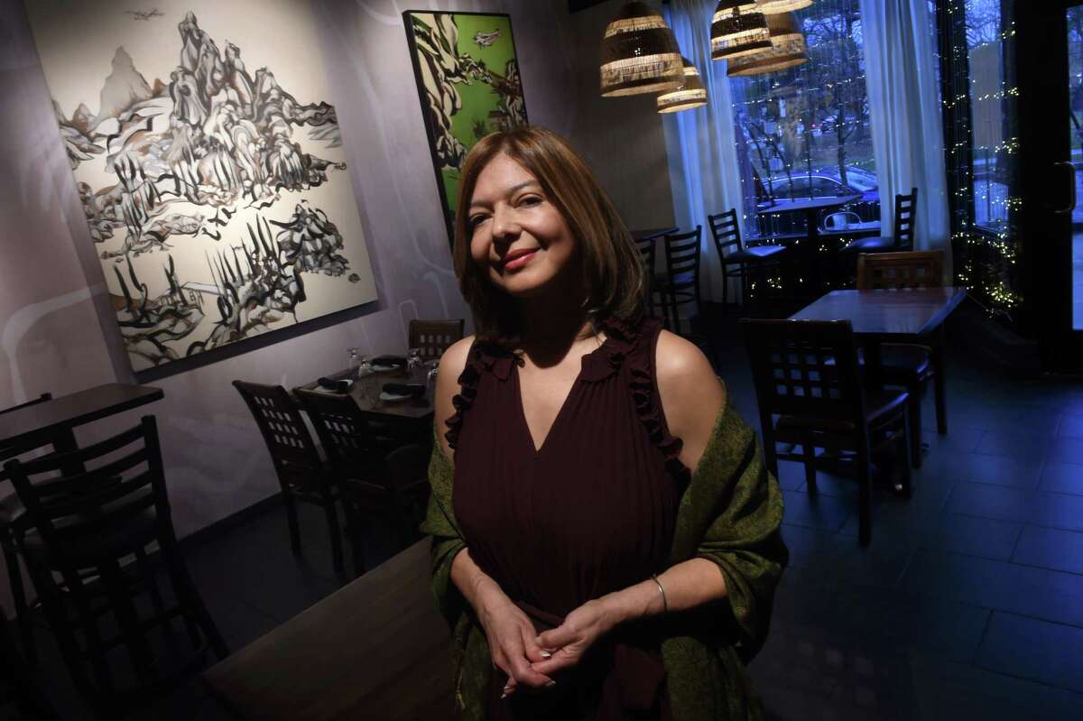 Ana De Los Angeles, owner of Manjares, is photographed in the new section of her business specializing in tapas and drinks on West Rock Avenue in New Haven.