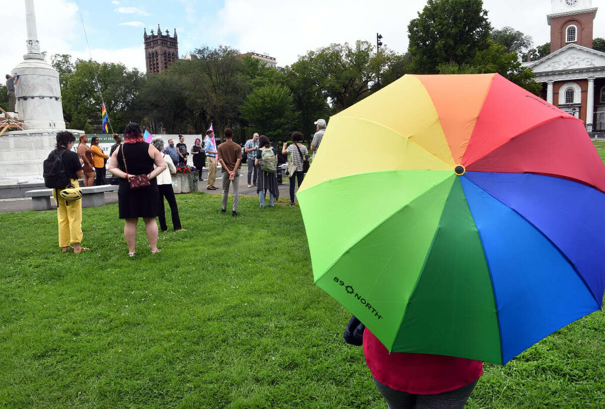 Attendees watch a Pride flag raising on the New Haven Green to kick off the Pride New Haven Festival on September 12, 2022. The acting executive director of the New Haven Pride Center, Juancarlos Soto, said the use of the term Latinx remains controversial, even among the LGBTQ community. 