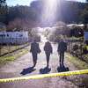 FBI officials walk toward the crime scene at Mountain Mushroom Farm on Tuesday, Jan. 24, 2023, after a gunman killed several people at two agricultural businesses in Half Moon Bay, Calif.