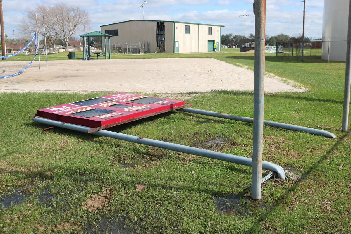 The scoreboard at Clyde Varnell Field is now flat on the ground after the ferocious winds from Tuesday's tornado bent the metal poles at the base.