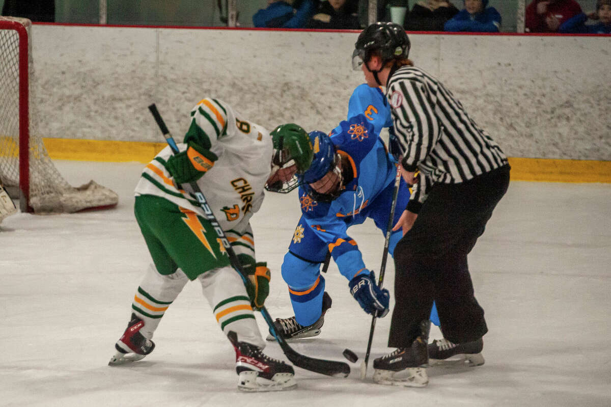 Dow and Midland high hockey players face off in a rivalry game on Jan.  25, 2023 at the Midland Civic Arena.