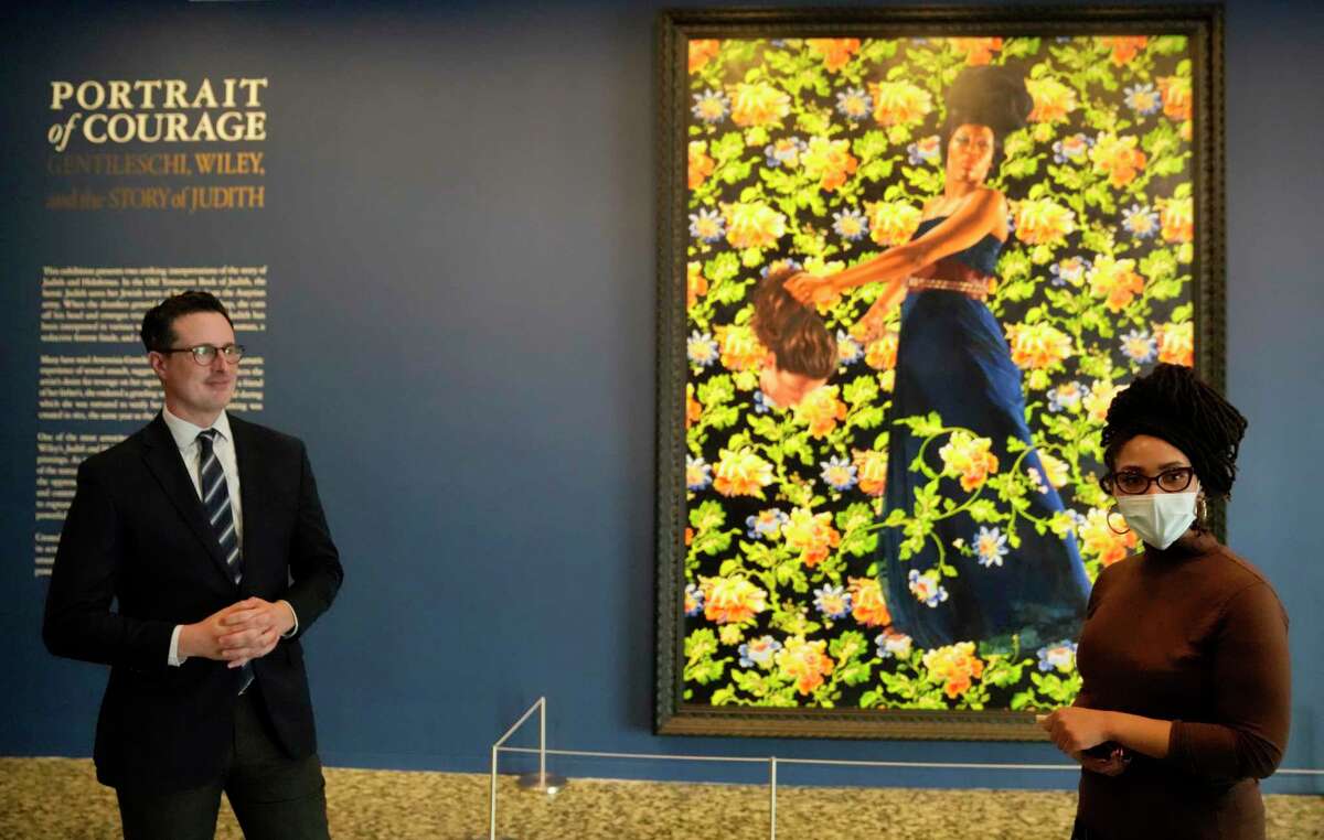 Curators James Anno, left, and Anita Bateman lead a discussion about Judith and Holofernes by Kehinde Wiley in the exhibit Portrait of Courage: Gentileschi, Wiley and the Story of Judith at The Museum of Fine Arts, Houston, 1001 Bissonnet St., Wednesday, Jan. 25, 2023, in Houston.