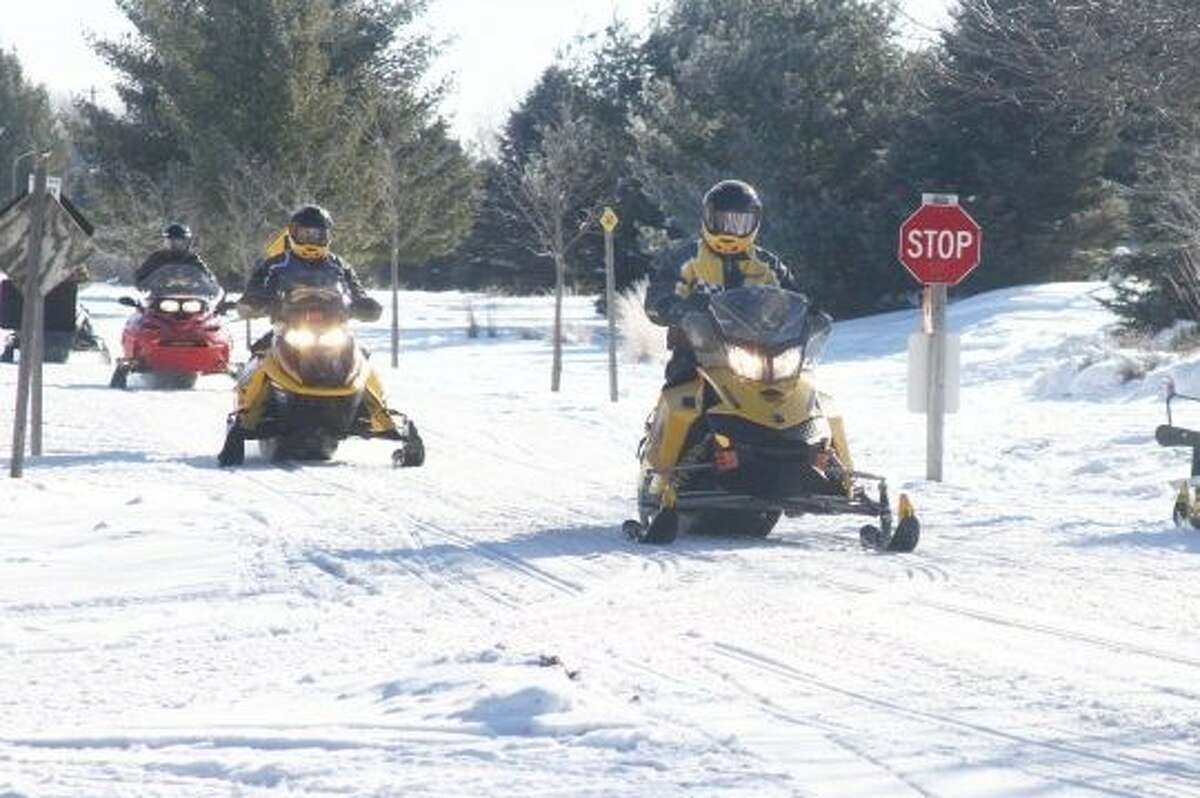 The DNR free snowmobiling weekend is scheduled for Feb. 11-12. A significant accumulation of snow is expected ahead of the event according to NOAA Grand Rapids. In this Pioneer file photo, snowmobilers prepare to travel the White Pine Trail.