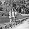 In this 1937 photo, (left to right) Laura Wells, Louise Cherry and Josephine Houston stand on the low water crossing at Brackenridge Park. The crossing has been a popular destination for decades, but has recently been closed to vehicle traffic.