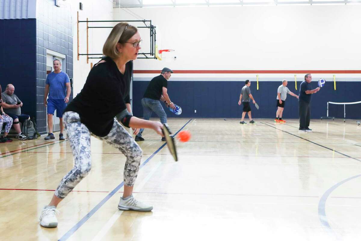 Laurie Stephens plays pickleball at Conroe’s newly opened Westside Recreation Center & Owen Park, Thursday, Jan. 26, 2023, in Conroe. Since August 2021, the city of Conroe has worked to repair and update the former Conroe Family YMCA property, which closed at the start of the pandemic.