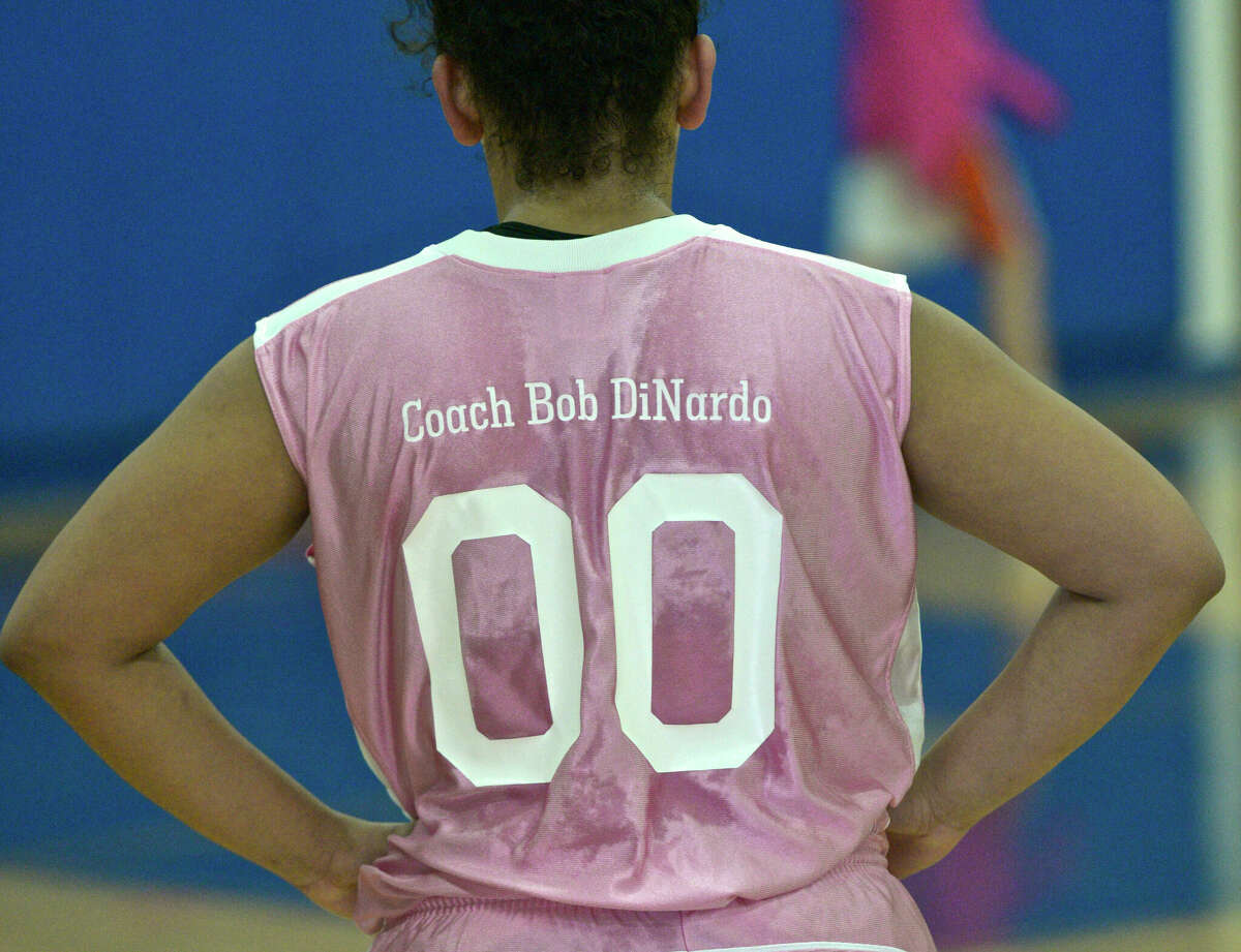 Danbury's Tianna Myers (00) during warm ups before the start of the 2015 memorial cancer fundraiser game in honor varsity girls basketball coach Jackie DiNardo's late husband Bob DiNardo, a Danbury police officer who died in 2009. The Hatters wear pink uniforms for the game each season.