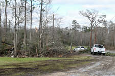 Vehicles make their way back to a damaged home in Bobcat Trails subdivision in Orangefield where a powerful tornado moved through the region Tuesday. Photo made Wednesday, January 25, 2023 Kim Brent/Beaumont Enterprise