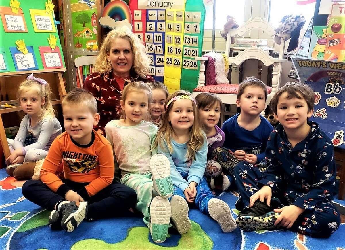 Preschool teacher Lynne Gatz and her students show off their outfits Pajama Day at Trinity Lutheran School.