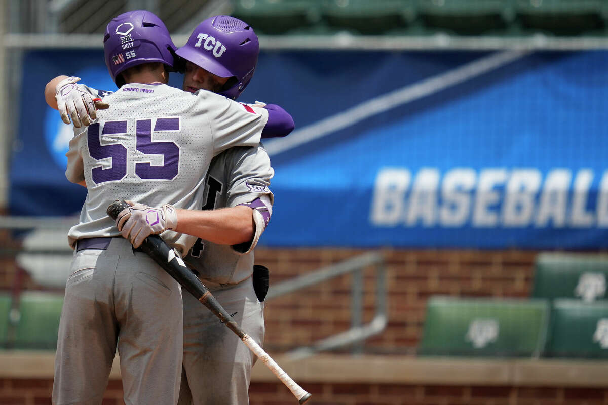 TCU infielder Brayden Taylor (55) hugs teammate TCU catcher Kurtis Byrne (4) after hitting a solo home run against Oral Roberts during an NCAA baseball game on Saturday, June 4, 2022, in College Station.