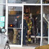 Firefighters respond to a report of a vehicle that hit the building containing Maurices just after 3 p.m. Thursday. 