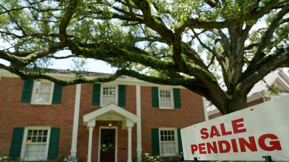 A sign is displayed outside a home for sale Thursday, July 30, 2020, in Houston.