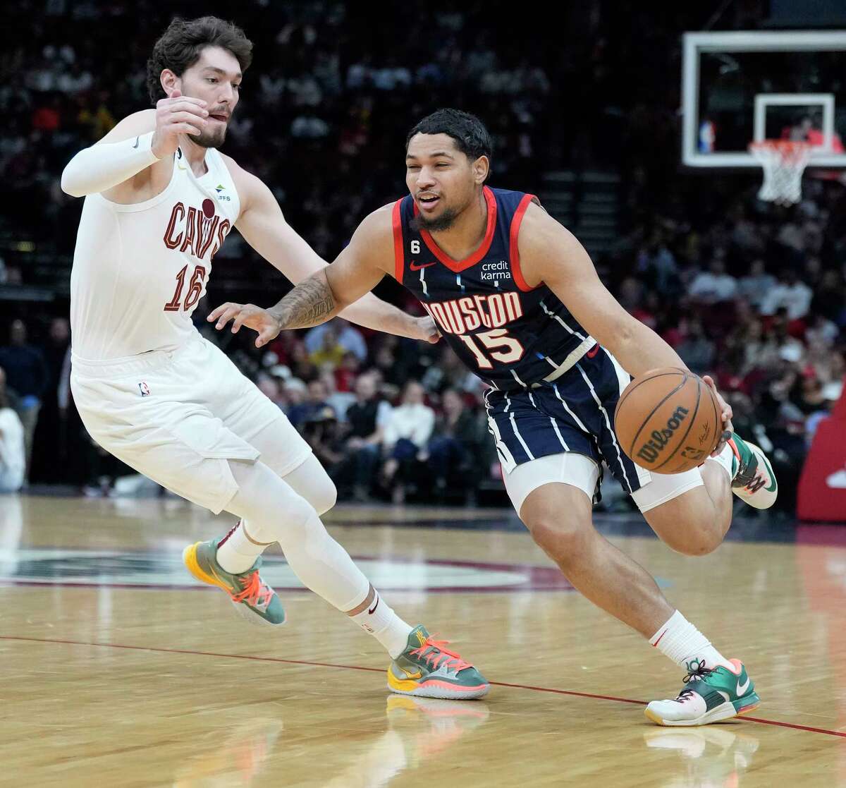 Houston Rockets guard Daishen Nix (15) works against Cleveland Cavaliers forward Cedi Osman (16) during the first half of a NBA basketball game at Toyota Center on Thursday, Jan. 26, 2023 in Houston.