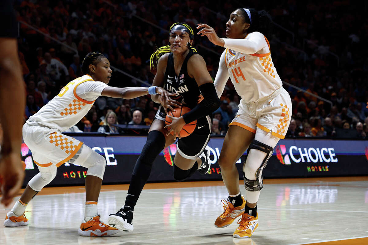 UConn forward Aaliyah Edwards (3) drives to shoot as she is defended by Tennessee forward Rickea Jackson (2) and guard Jordan Horston (25) during the first half of an NCAA college basketball game, Thursday, Jan. 26, 2023, in Knoxville, Tenn. (AP Photo/Wade Payne)