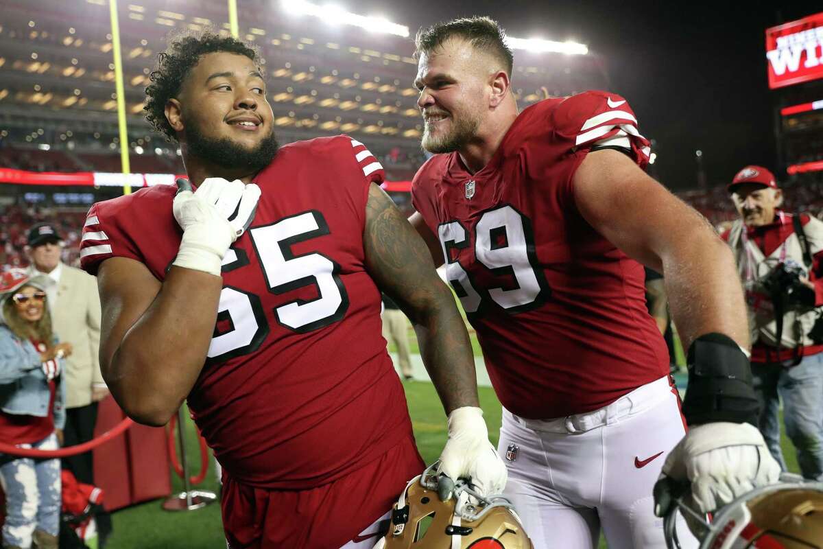 San Francisco 49ers guard Aaron Banks (65) runs on the field during the  first half of