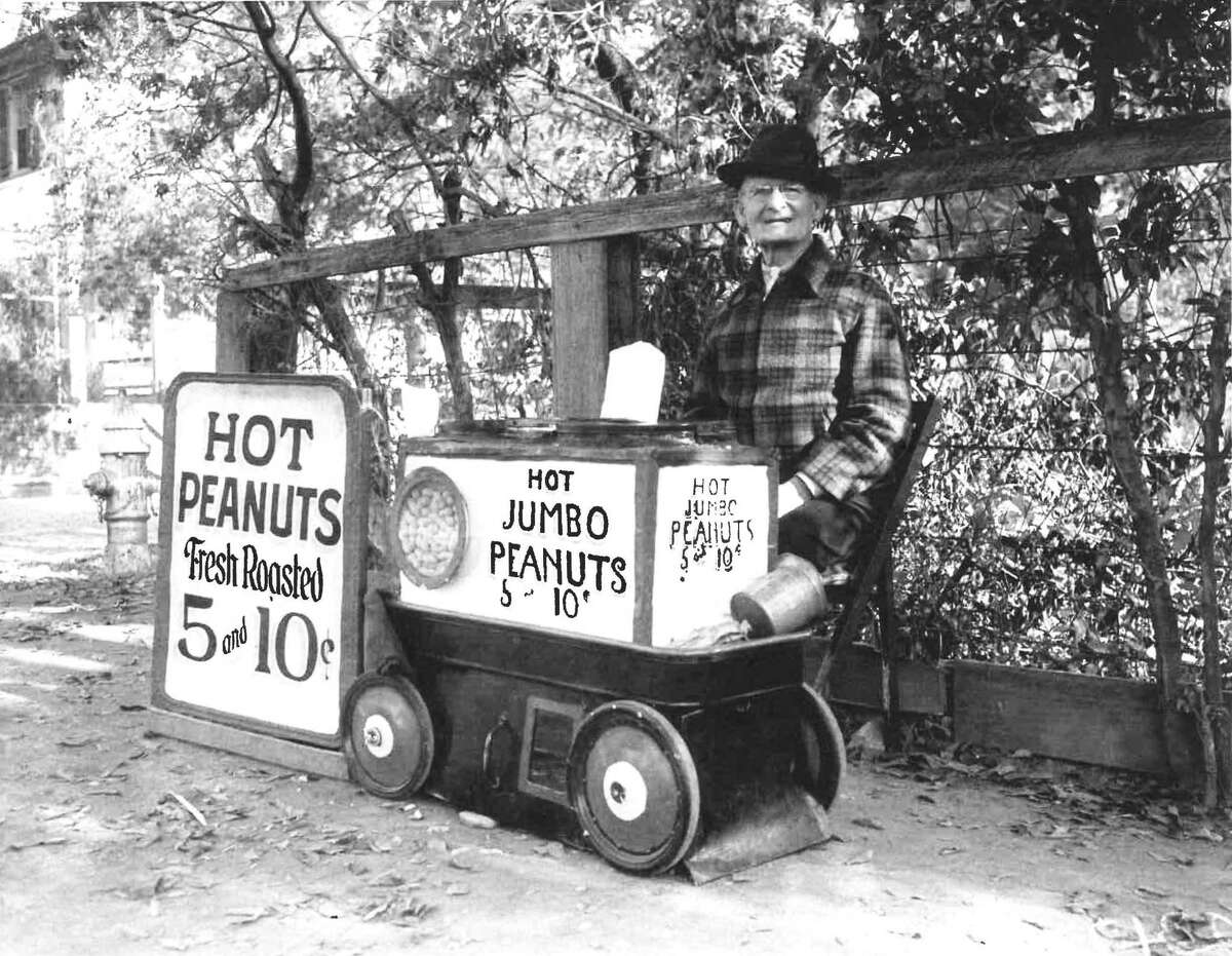 Danish immigrant Emil Rasmussen sells peanuts on the corner of Brooklyn Avenue and Augusta Street in this photograph published in the San Antonio Light, Dec. 10, 1939. A former toolmaker, Rasmussen said he built the small stove under his wagon for keeping his wares warm.