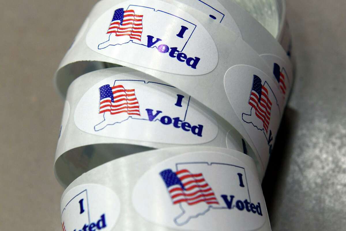 Stickers await voters on Election Day at Foran High School, in Milford, last year.