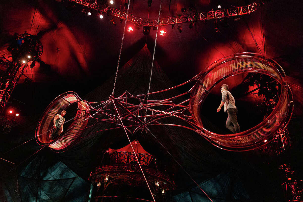 Two acrobats practice on the Wheel of Death, one of the most thrilling elements in Cirque du Soleil's "Kooza" show.