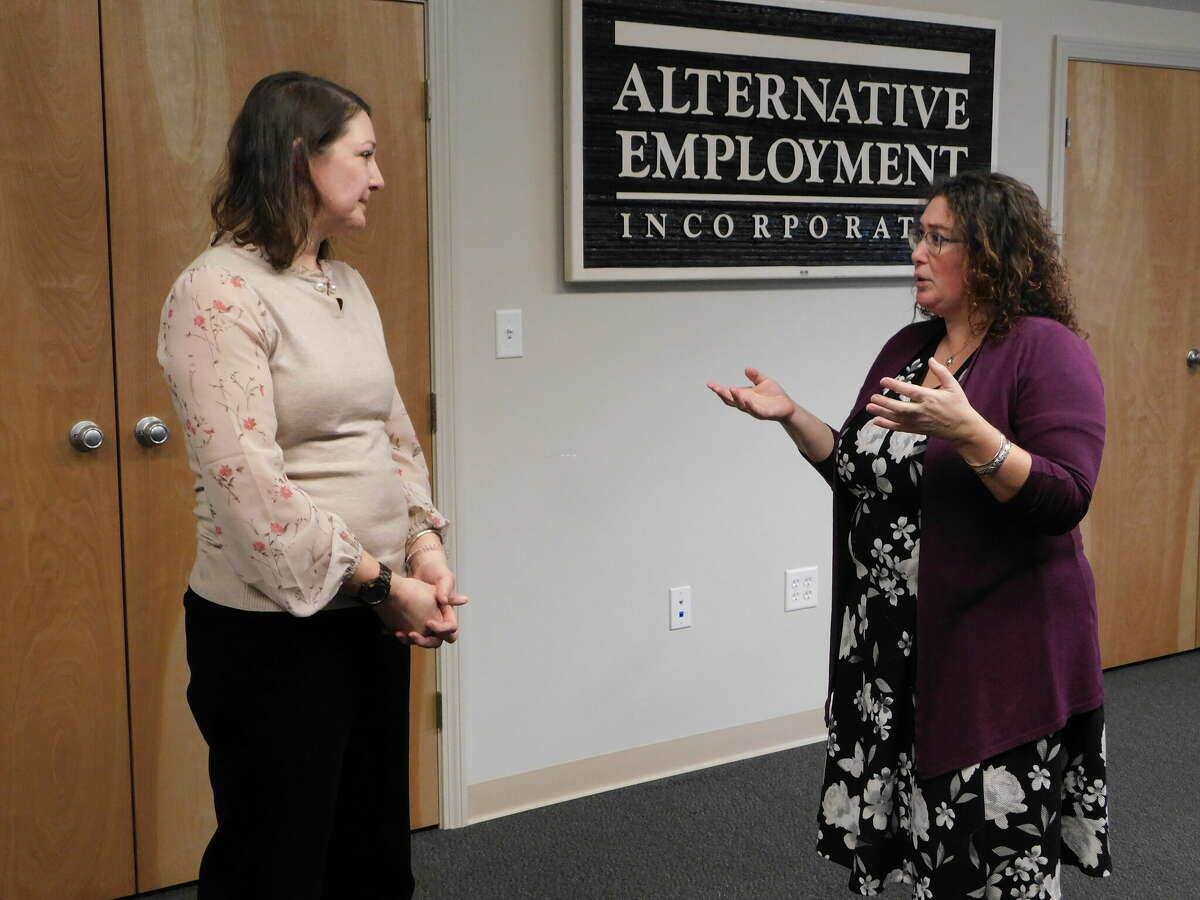 Allison Blackwood, left, president of AEI, talks with Rista Malanca, Torrington’s director of economic development.