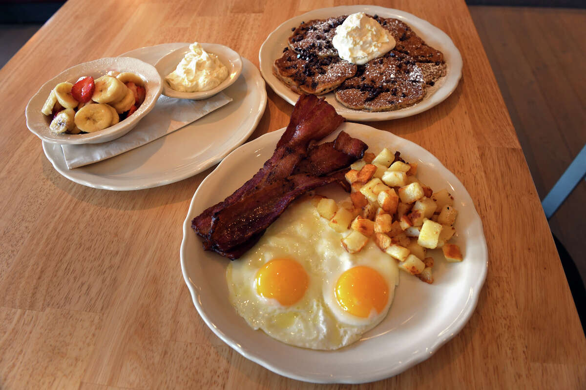 Eggs and bacon with home fries served at the Original Pancake House location in Westport, Conn. Jan. 27, 2023.
