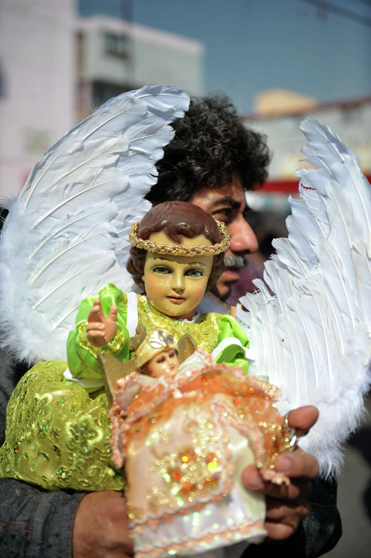 A man carries a Baby Jesus at Candelaria neighbourhood in Mexico City, during Candlemas Day (Dia de la Candelaria), on February 2, 2012. Candlemas or the Feast of the Purification, falls forty days after Christmas and is celebrated by Catholics as the presentation of Christ at the Temple. 