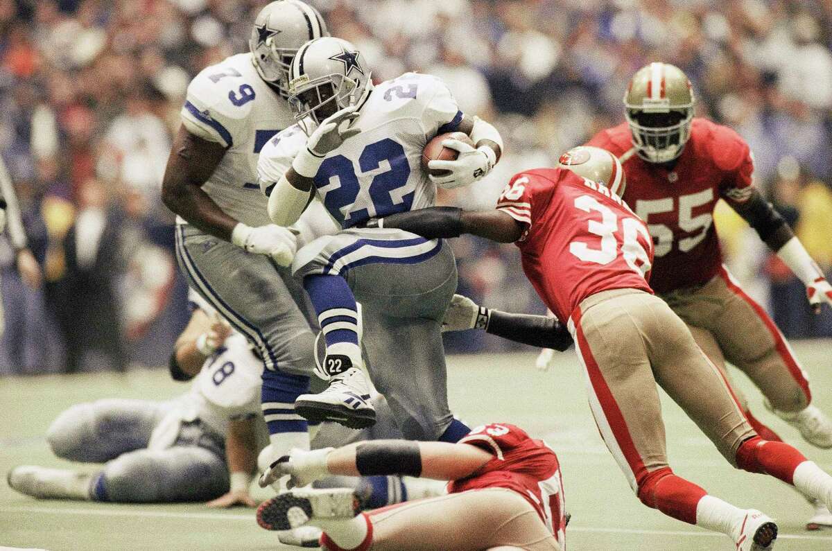 Gene Washington, San Francisco Forty Niners, is tended in the end zone  after he had scored touchdown on pass from quarterback John Brodie (12) in  second period of the game with the