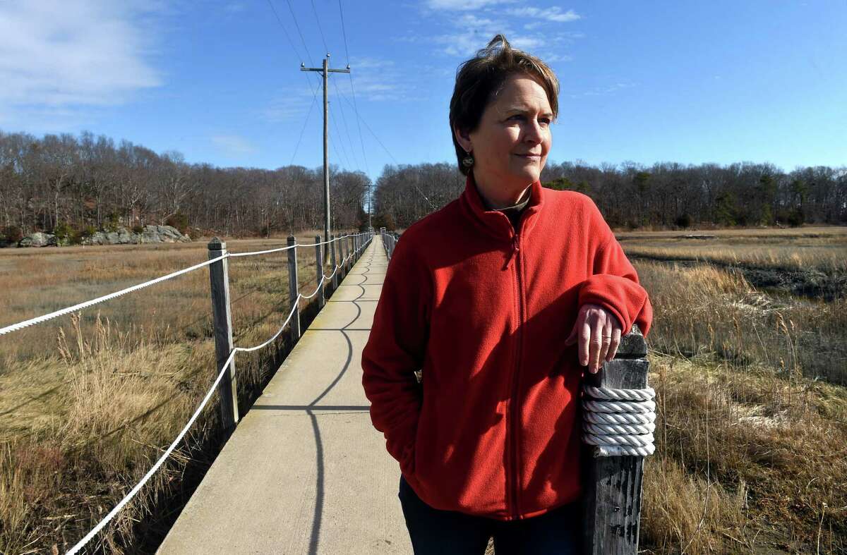 Children's book author Kimberly Behre Kenna photographed by the salt marsh on the Shoreline Greenway Trail in Branford on January 27, 2023.