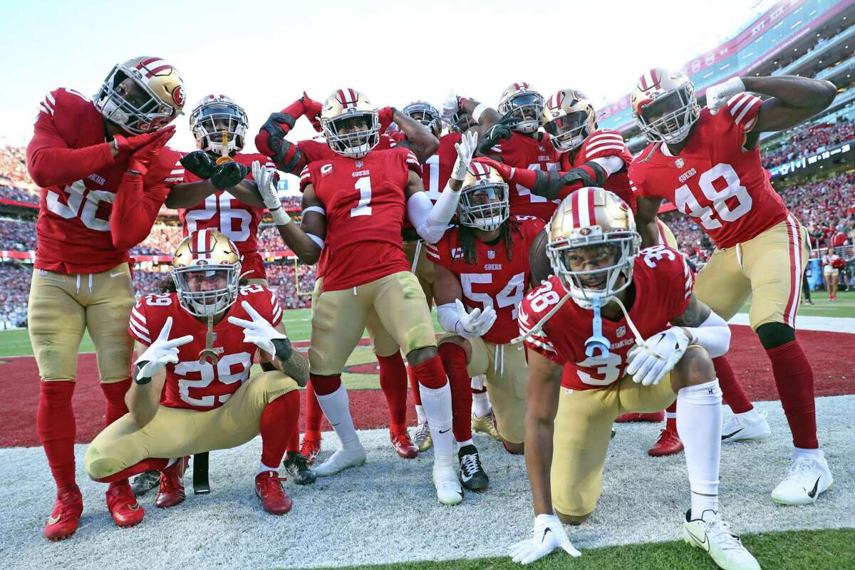 The 49ers defense celebrates Fred Warner’s interception during 19-12 win over the Cowboys in the NFC divisional Playoff game at Levi’s Stadium in Santa Clara.