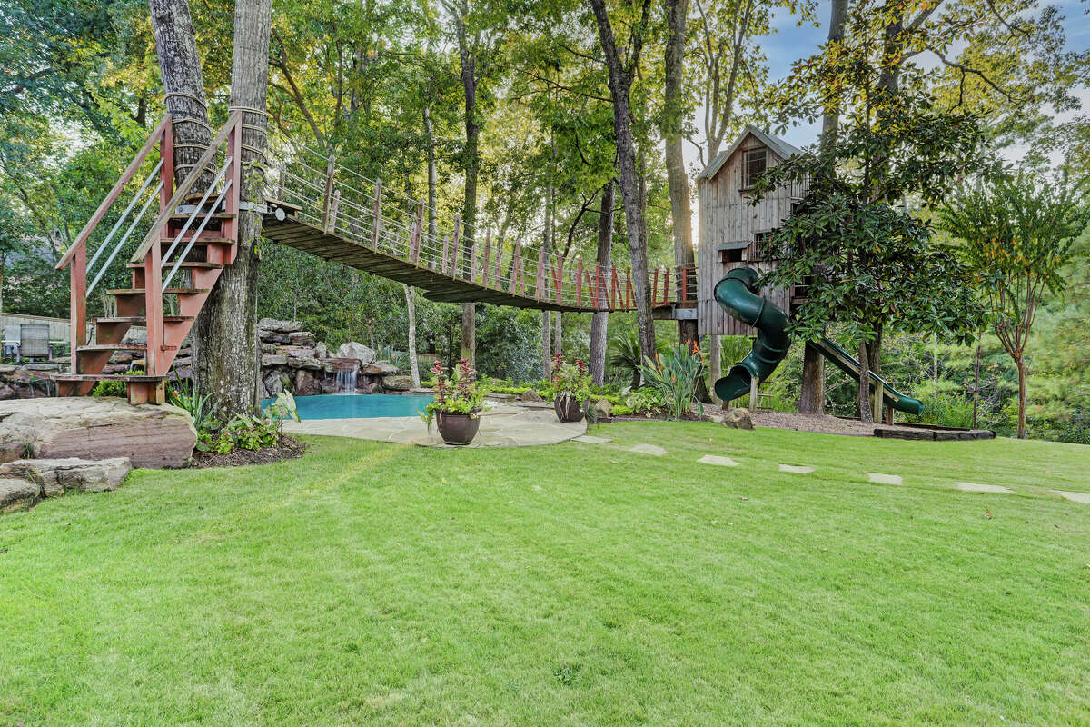 The treehouse is accessible via rope ladder or the swinging bridge