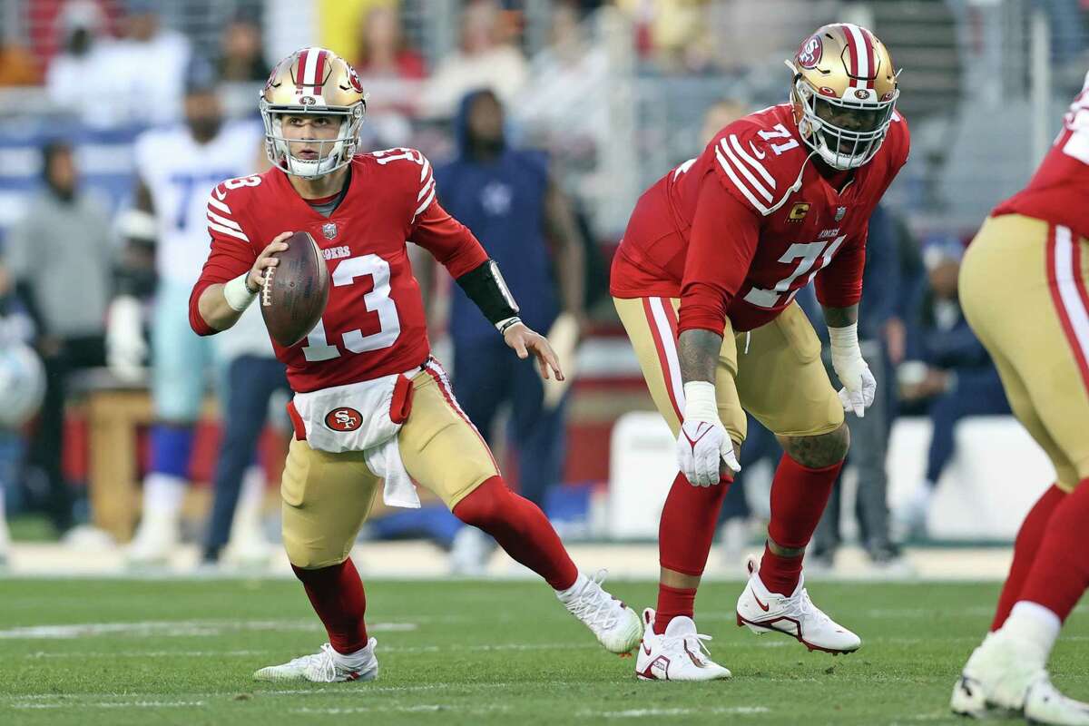 San Francisco 49ers’ Brock Purdy and Trent Williams during 19-12 win over Dallas Cowboys during NFC Divisional Playoff game in Santa Clara, Calif., on Sunday, January 22, 2023.