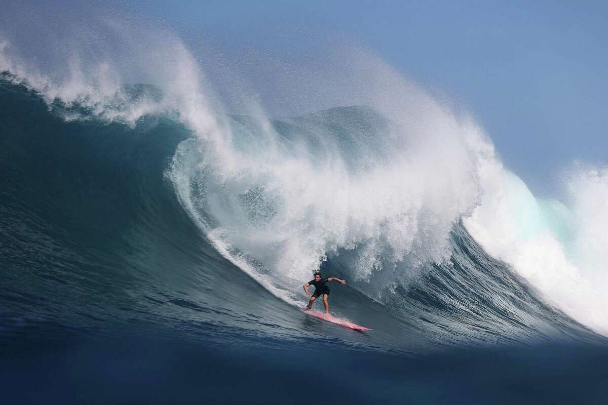 San Francisco's Bianca Valenti, shown surfing at Waimea Bay in January 2023, was inducted into the California Outdoors Hall of Fame.