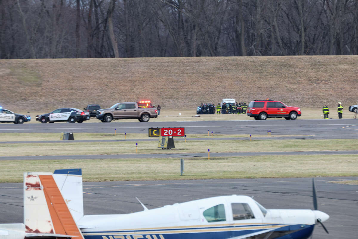 Emergency crews gathered just off the tarmac at Brainard-Hartford Airport in Hartford on Saturday afternoon after a reported plane crash. 