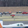 Emergency crews gathered just off the tarmac at Brainard-Hartford Airport in Hartford, Conn. Saturday afternoon after a reported incident. 
