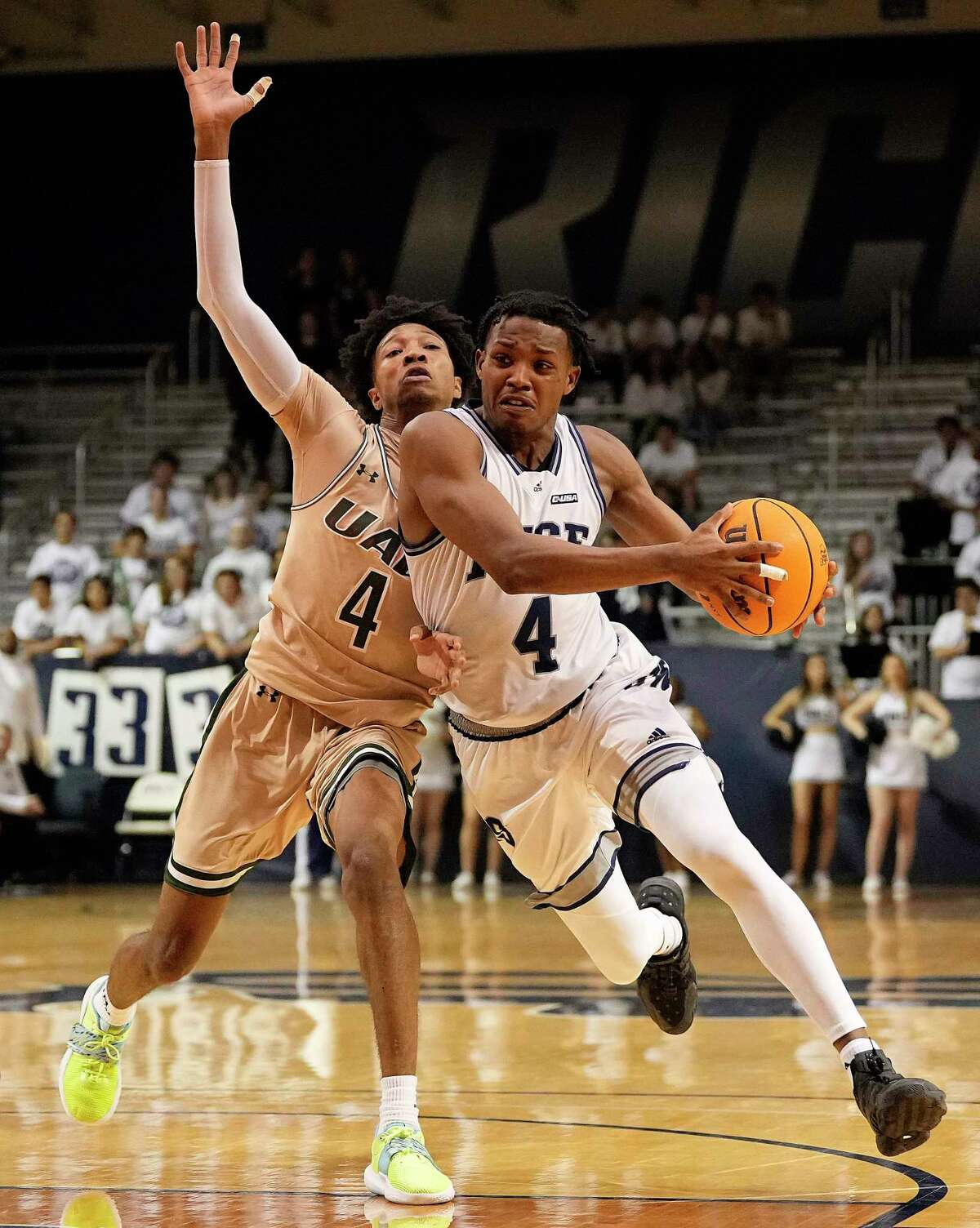 UAB Blazers guard Eric Gaines bumps Rice Owls guard Quincy Olivari off course causing a miss during the second half of an NCAA college basketball game at Tudor Field House, Saturday, Jan. 28, 2023, in Houston.