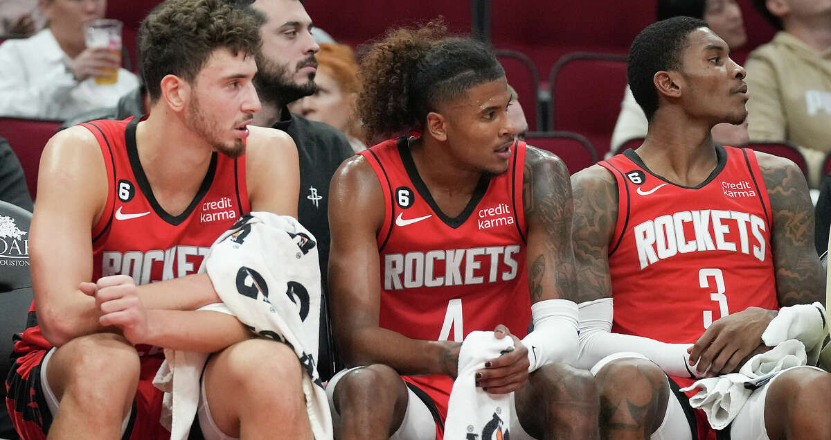 Houston Rockets center Alperen Sengun (28), from left, guards Jalen Green (4) and Kevin Porter Jr. (3) take a breather near the end of the first quarter against LA Clippers at the Toyota Center on Monday, Nov. 14, 2022 in Houston.