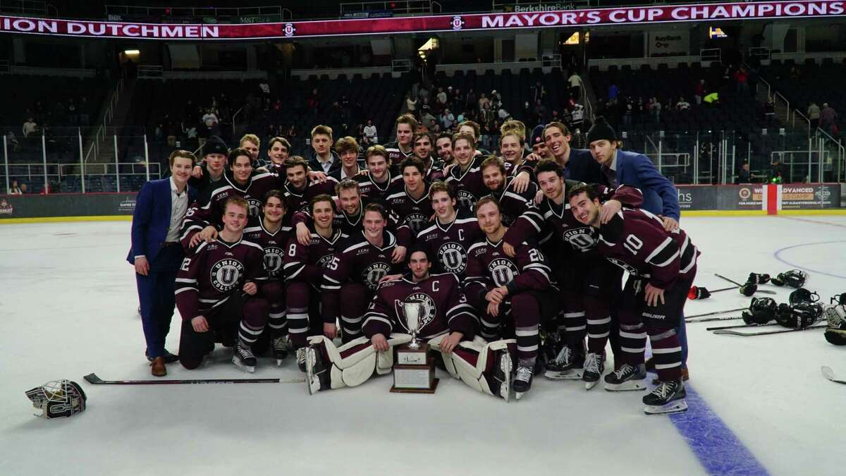 The Union team poses with the Mayor's Cup after beating RPI 6-0 on Saturday, Jan. 28, 2023, at MVP Arena.