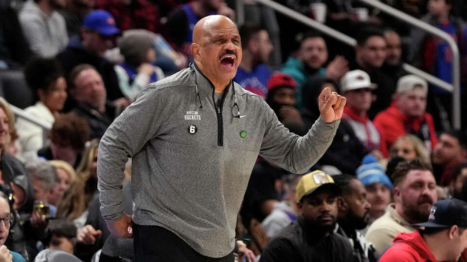 Houston Rockets assistant coach John Lucas II yells from the sideline during the first half of an NBA basketball game against the Detroit Pistons, Saturday, Jan. 28, 2023, in Detroit. (AP Photo/Carlos Osorio)