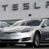 Tesla Model S sedans sit on display outside a showroom in Littleton, Colo. A Model S caught fire by the side of a Sacramento-area freeway, officials said.