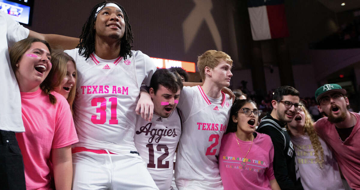 Texas A&M forward Javonte Brown (31) sways to the Texas A&M War Hymn with the student section after an NCAA college basketball game against Vanderbilt in College Station, Texas, Saturday, Jan. 28, 2023. (Logan Hannigan-Downs/College Station Eagle via AP)